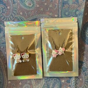 Two pairs of hello Kitty earrings